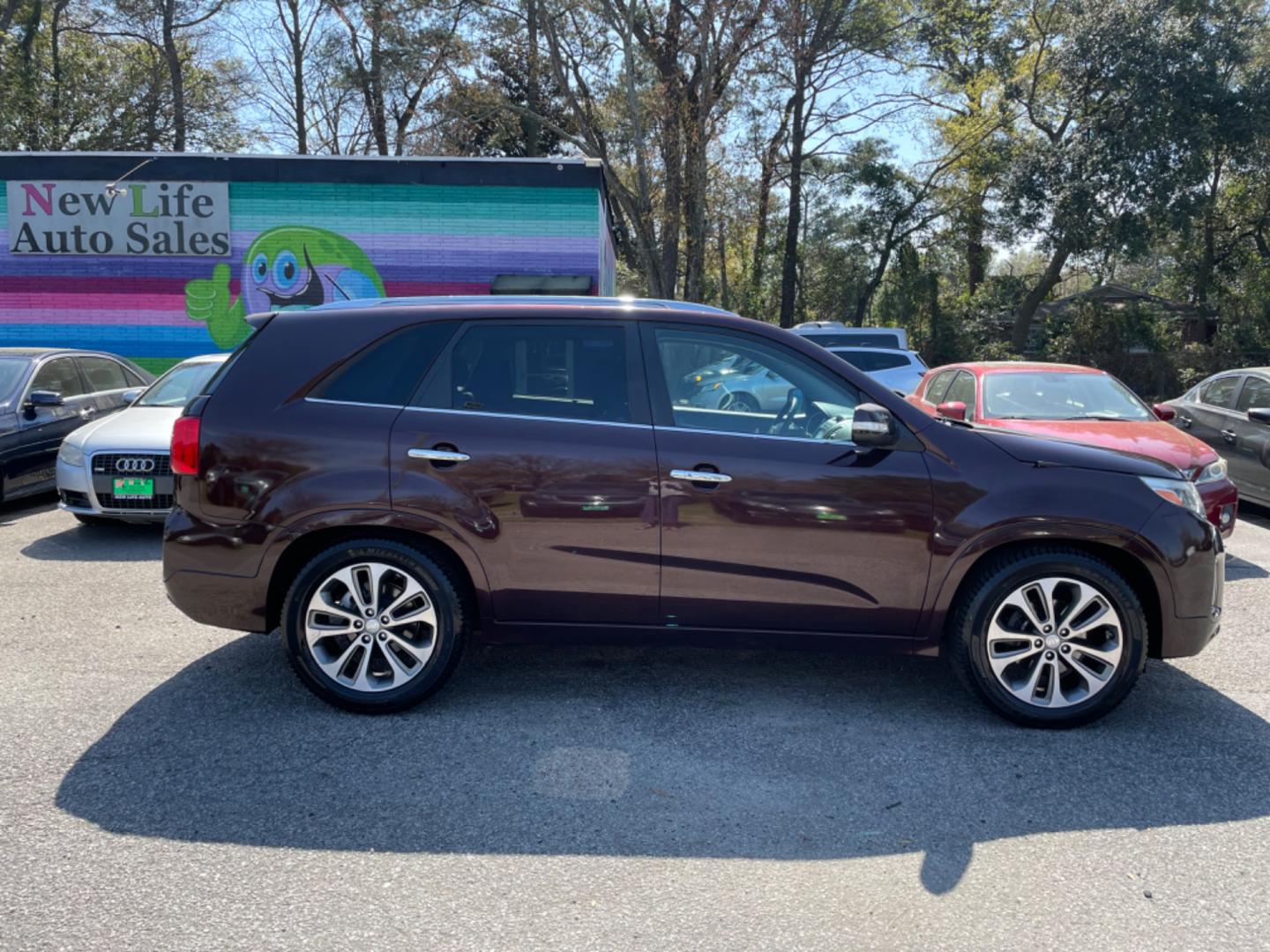 2015 PLUM KIA SORENTO SX (5XYKW4A77FG) with an 3.3L engine, Automatic transmission, located at 5103 Dorchester Rd., Charleston, SC, 29418-5607, (843) 767-1122, 36.245171, -115.228050 - Local Trade-in with Leather, Panoramic Sunroof, Navigation, Backup Camera, CD/AUX/Sat/Bluetooth, Dual Climate Control, Power Everything (windows, locks, seats, mirrors), Heated/Cooled/Memory Seating, Power Liftgate, Convenient Third Row, Push Button Start, Keyless Entry, Alloy Wheels. Certified One - Photo#7